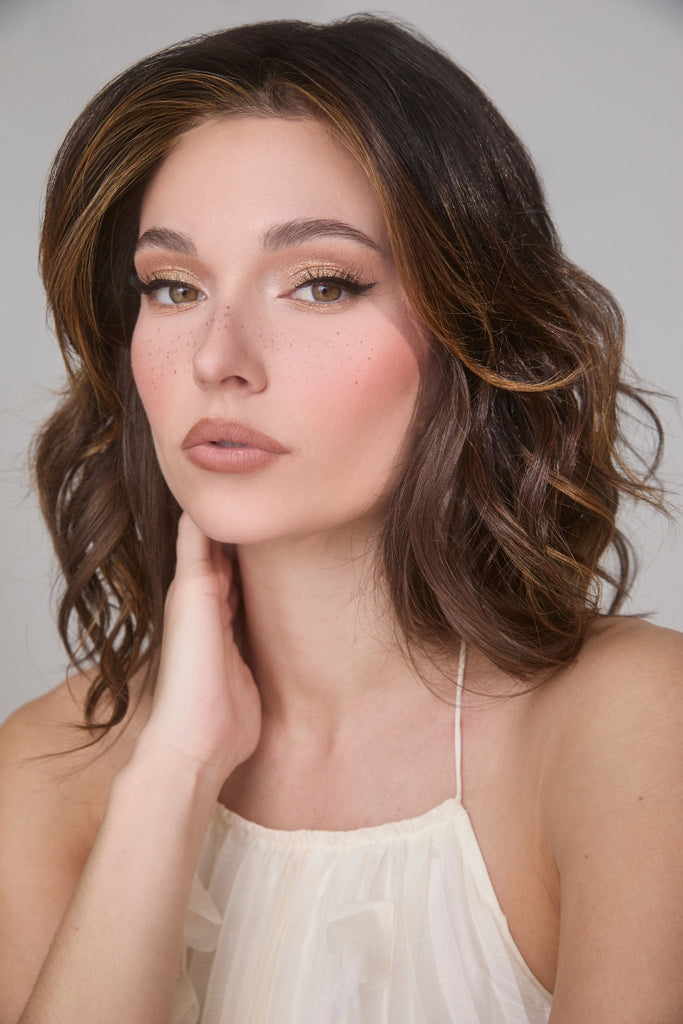 Model styling the Medium Wavy TP Mono in the color Marble Brown. 