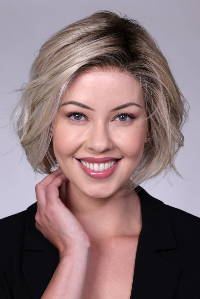 Model wearing a short layered bob