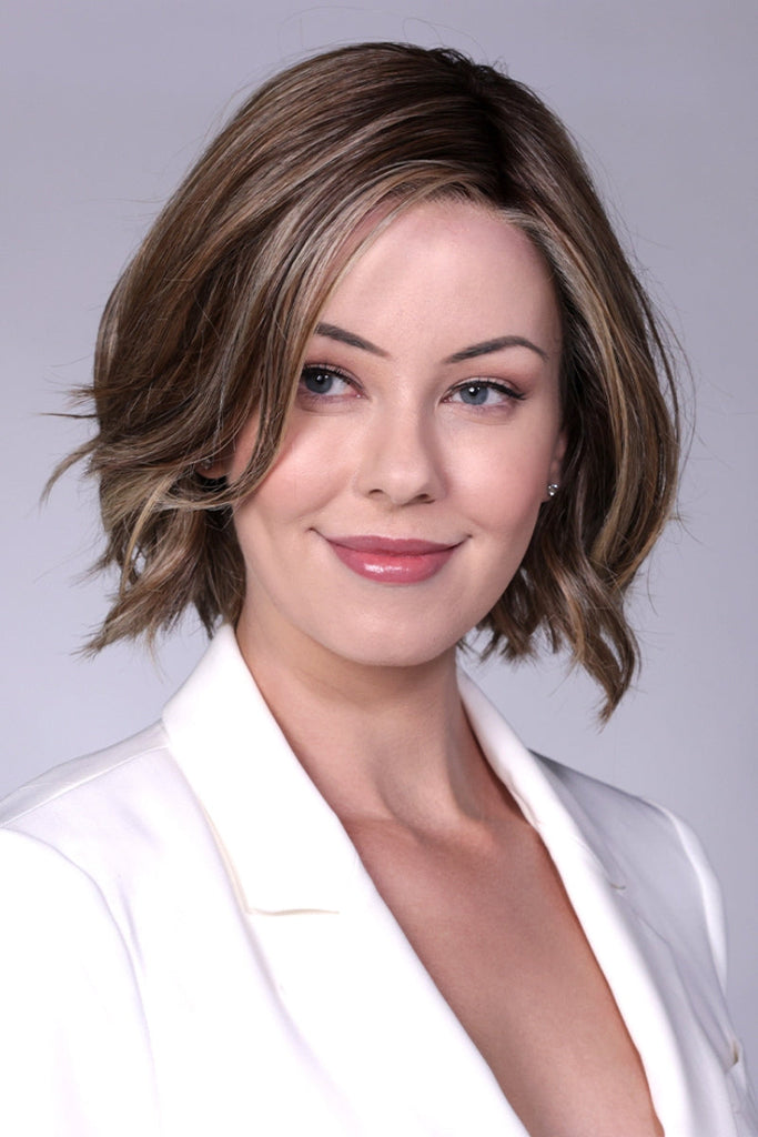 Front close up of women modeling a long length bob cut wig with a subtle wave.