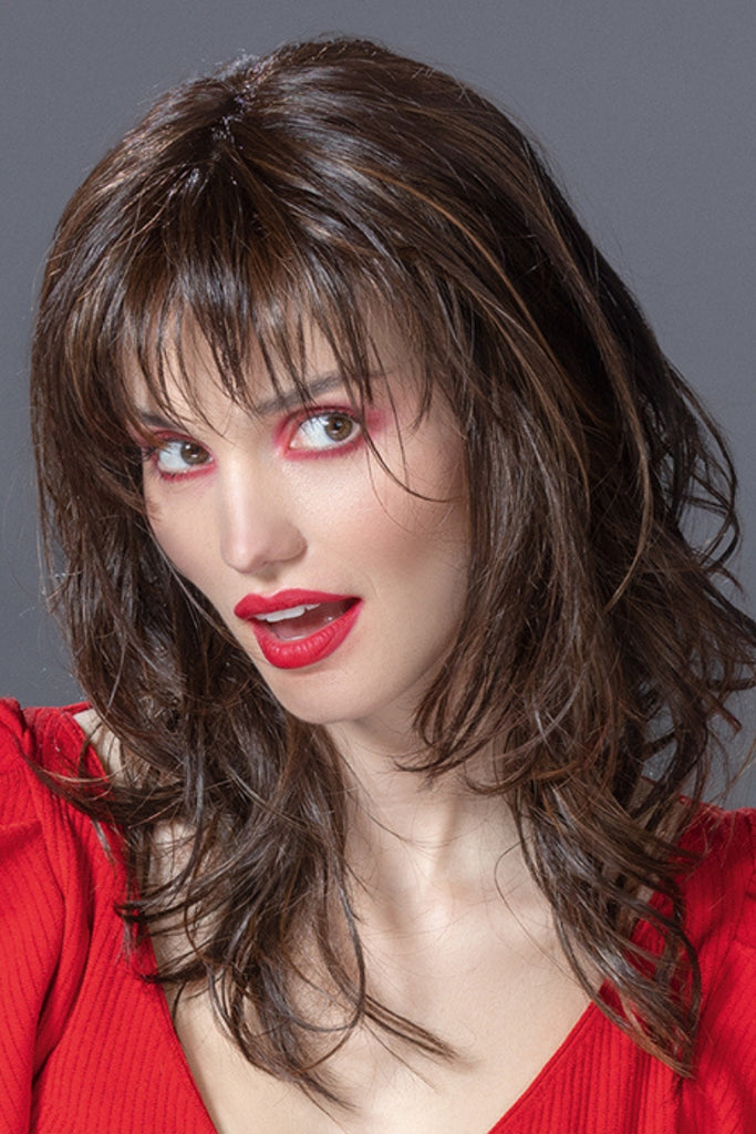 Model wearing the long layered style with bangs.