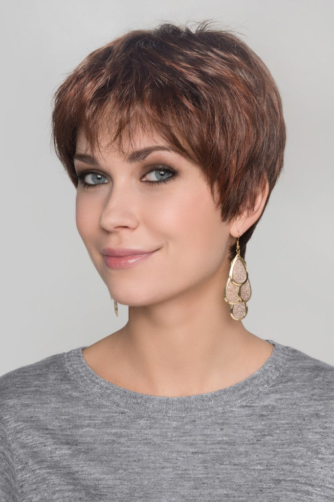 Women styling the Zizi wig by Ellen Wille in the color Dark Auburn Mix.