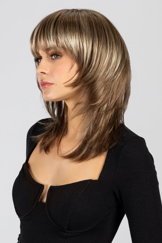 Side view of a woman wearing Miranda by Envy Wigs.