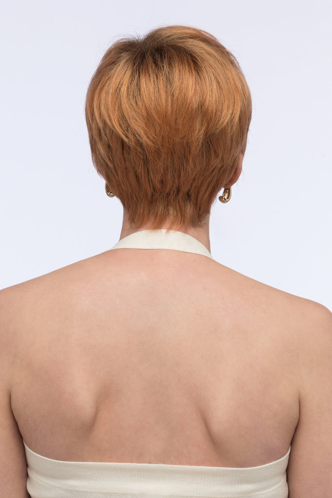 Back of woman wearing a pixie cut wig.