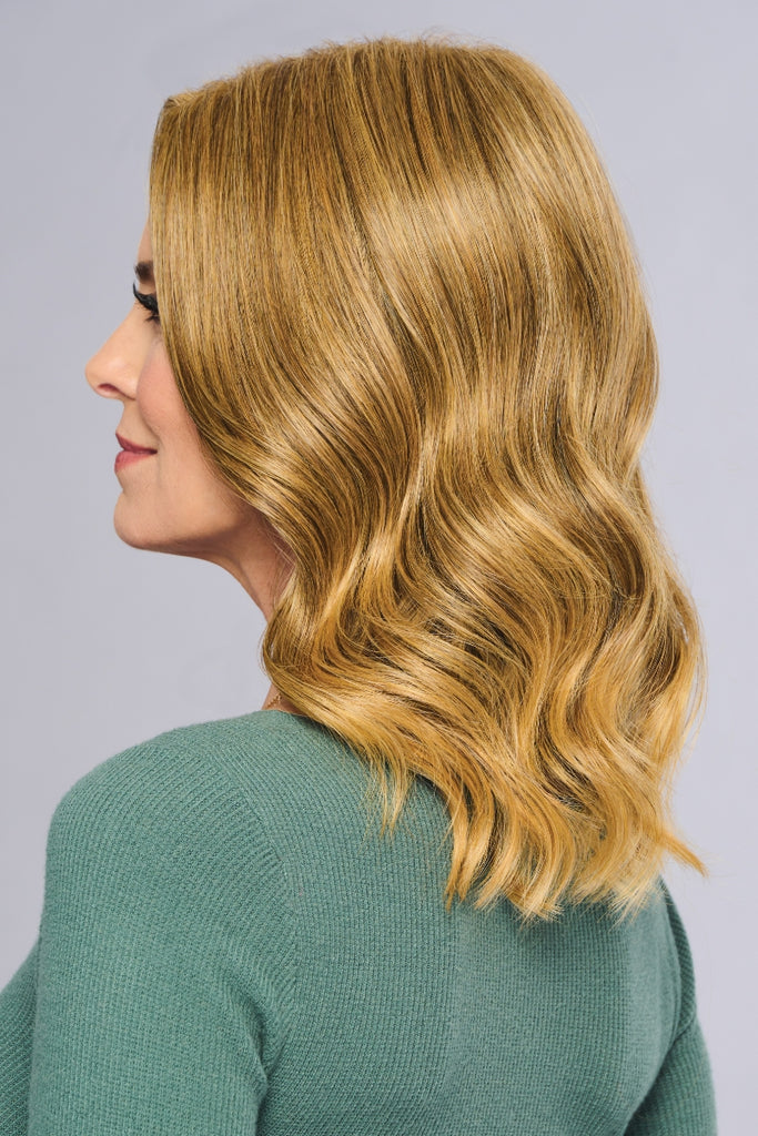 Side view of the medium length wavy wig.