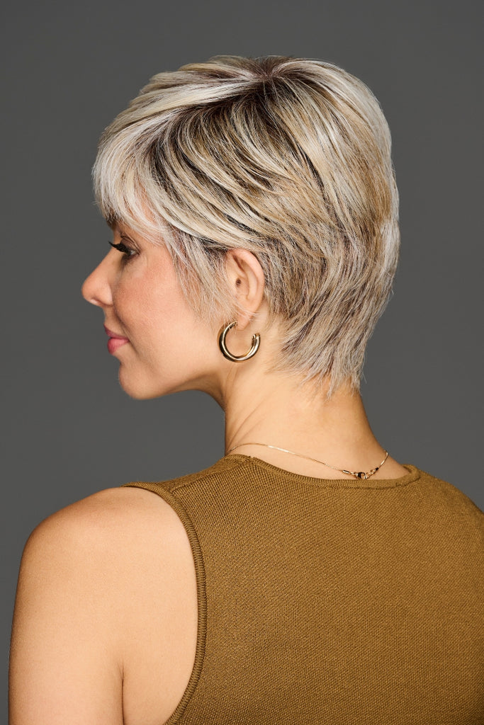 Side view of woman wearing a wig in the color SS Biscuit.