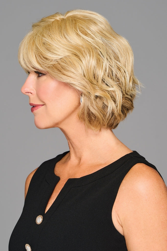 Side view of the layered topper with bangs.