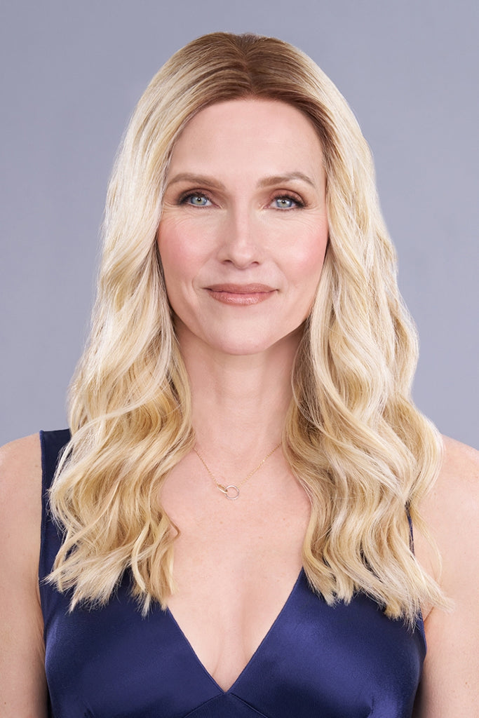 Front view of woman wearing a long length topper.