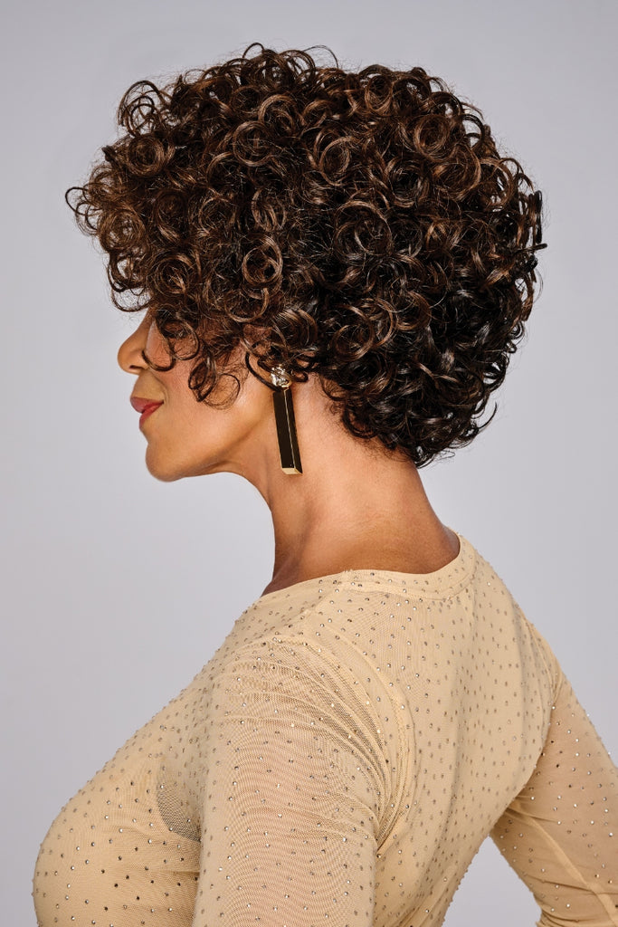 Side of model wearing a spiral curl wig.