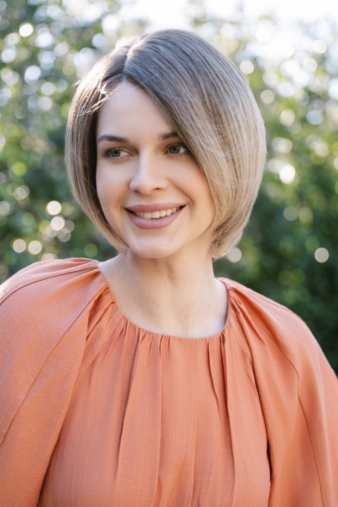 Model wearing Alina in Sunlit Sand by Orchid Wigs.