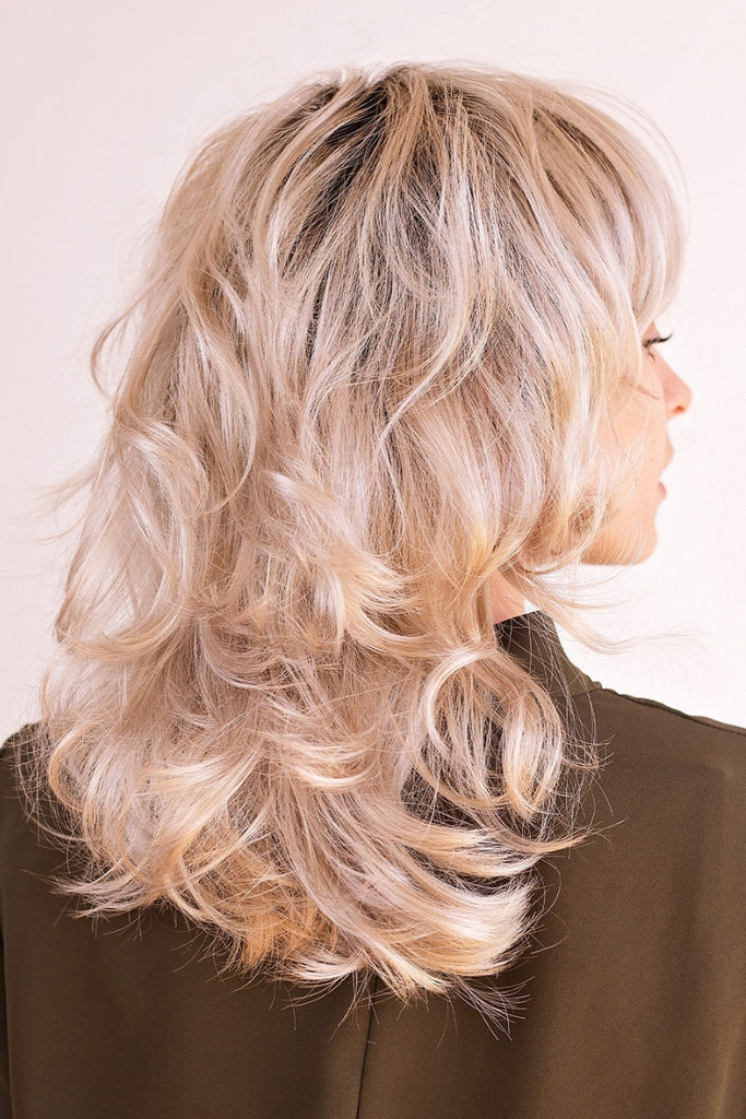 Back of a woman's synthetic wig in the color Rooted Icing.