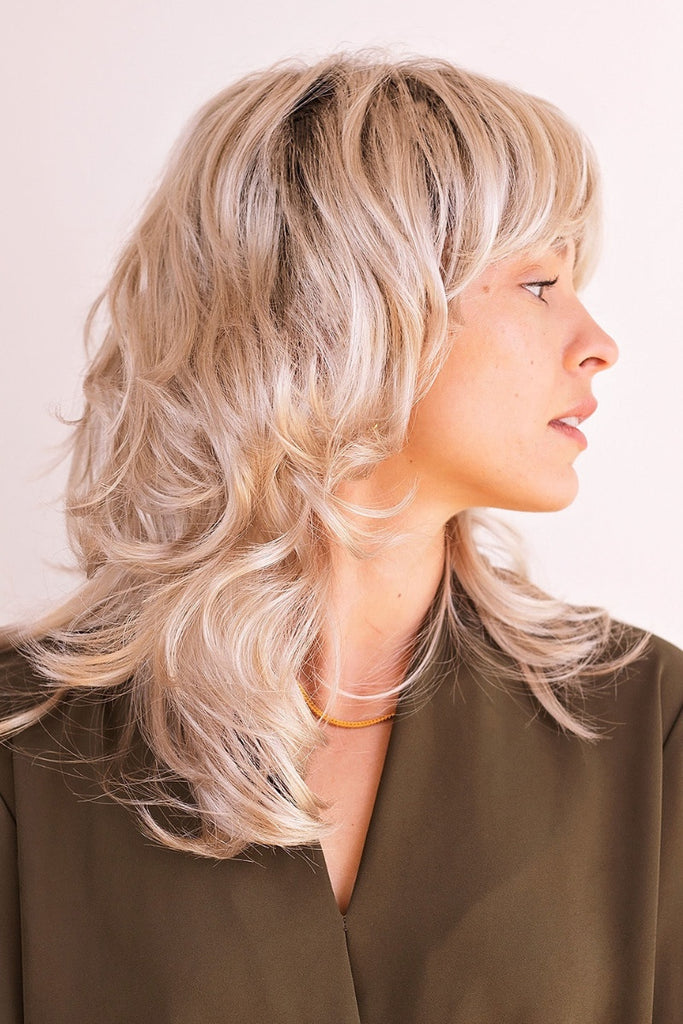 Side view of woman wearing a Tony of Beverly wig called Rani.